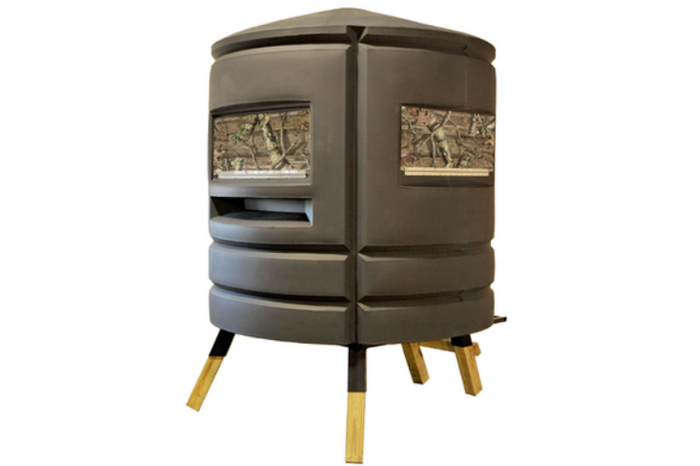 A deer hunting blind equipped with bow windows, ideal for hunting.