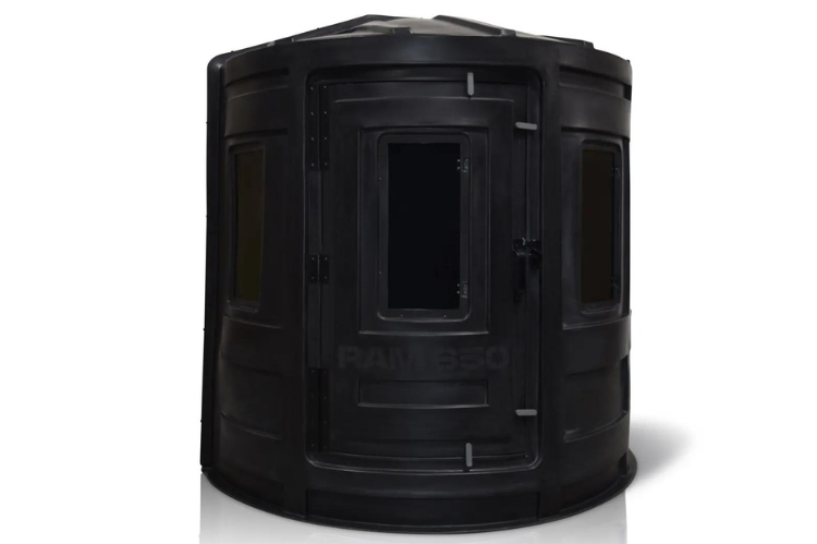 A deer hunting blind with a ladder, suitable for hunting, showcasing RAM 650 acrylic windows for both bow and gun enthusiasts.