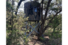 An elevated hunting blind from Banks Outdoors named The Stump for bow hunter with tinted windows for outdoor and hunting enthusiast.