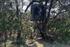 An elevated hunting blind from Banks Outdoors named The Stump for bow hunter with tinted windows for outdoor and hunting enthusiast.